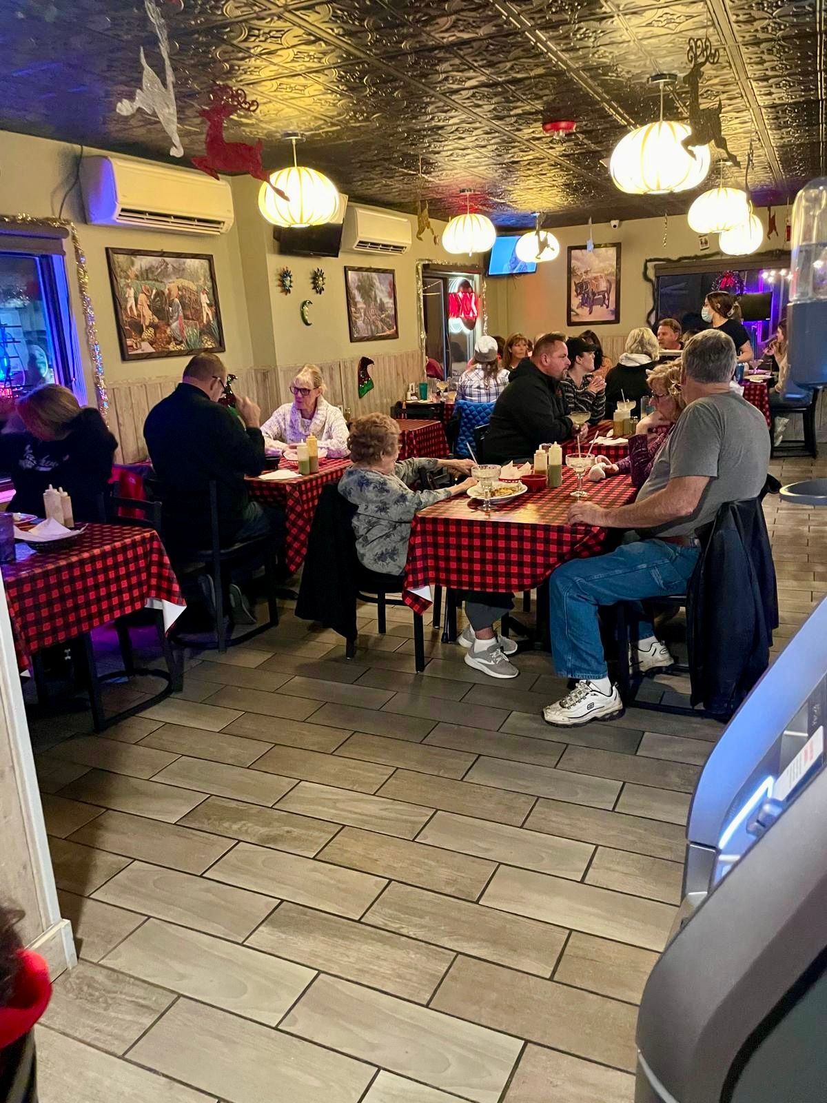 Candid restaurant atmosphere inside El Sureño