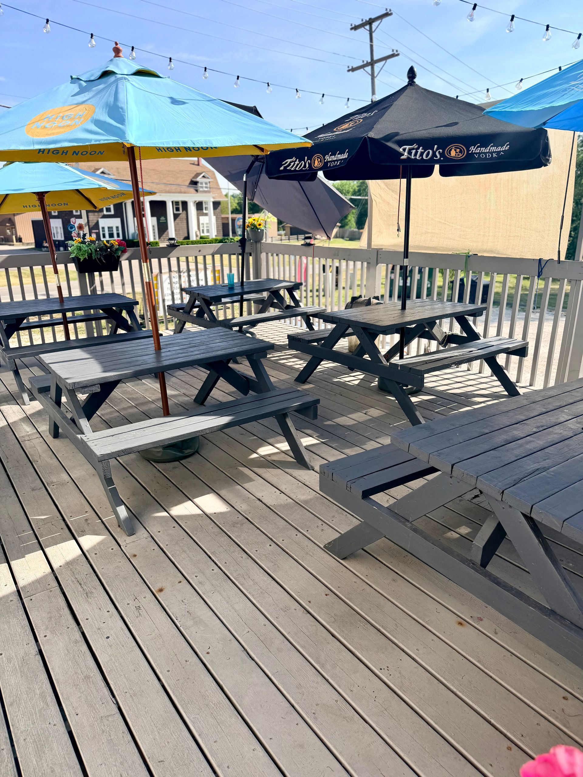 Outdoor patio tables and umbrellas at El Sureño