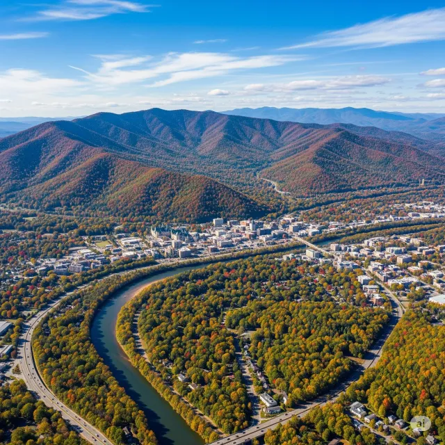 An aerial view of a residential area with a highway and a baseball field.