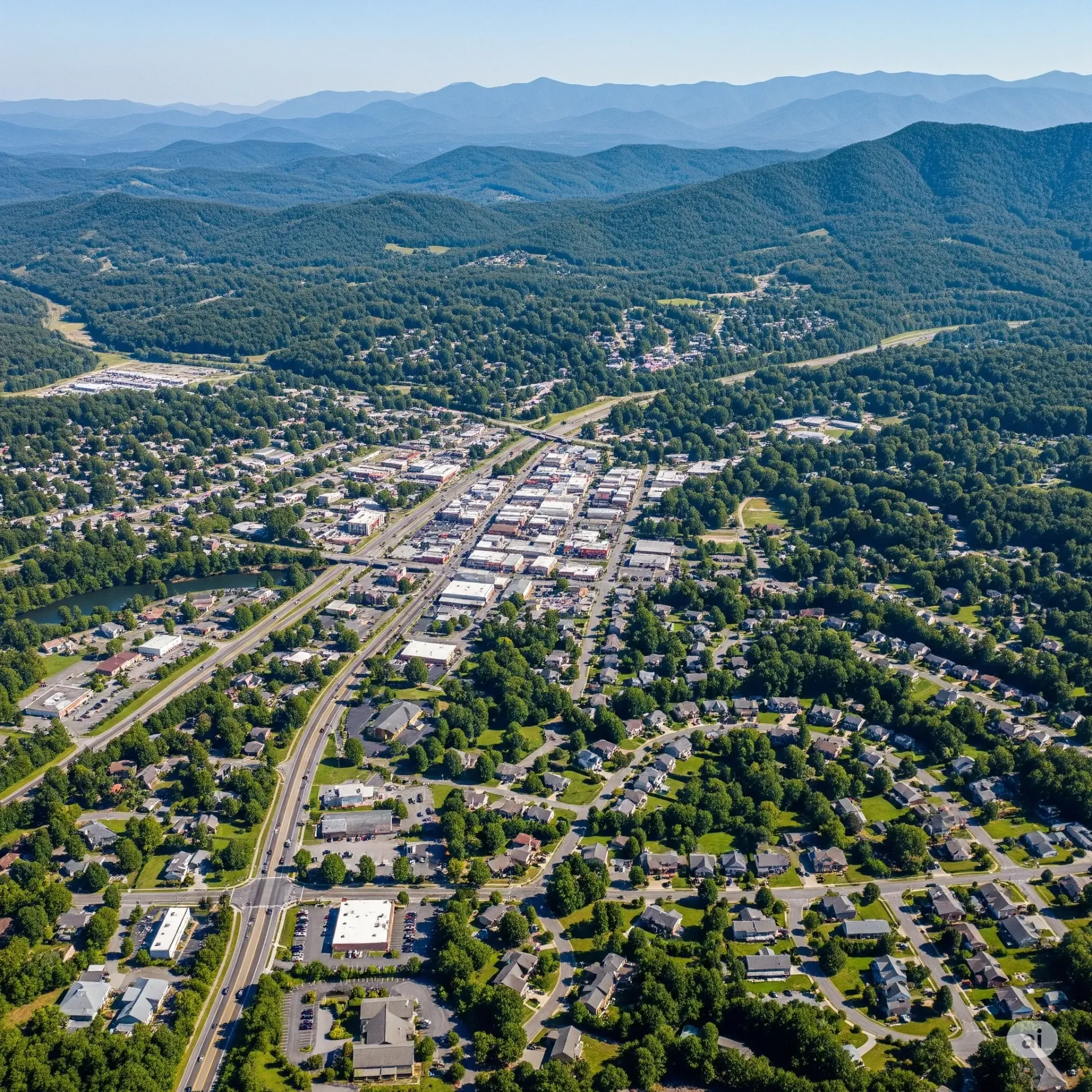 An aerial view of a city with a lake in the background.