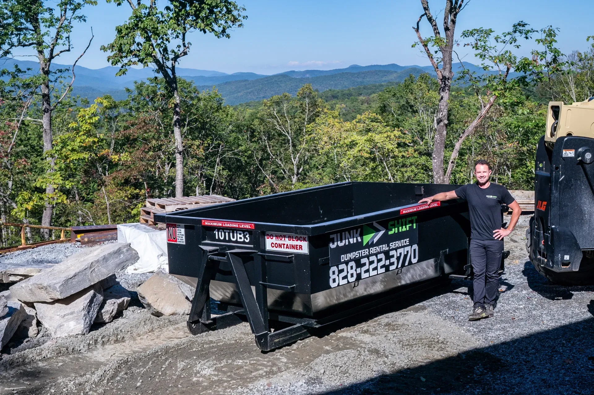 A red suv is parked in the snow in front of a house.