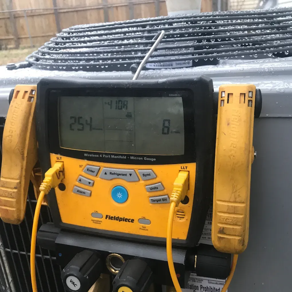 A yellow and black device with the number 25 on it