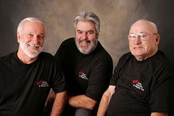 Three men posing for photo | Bill's Auto Electri Repair Inc