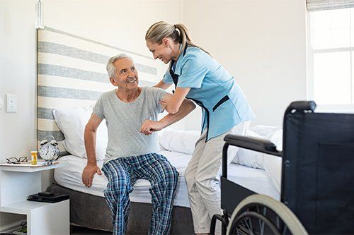 Caregiver Assisting Her Patient