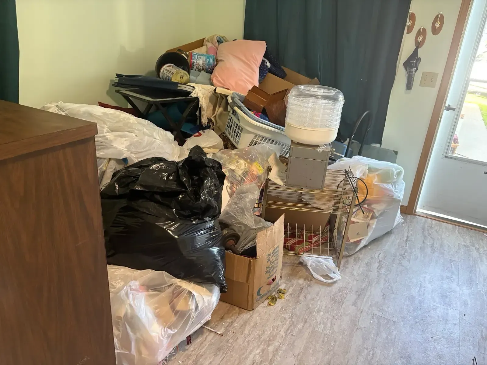 A room filled with lots of trash and boxes.