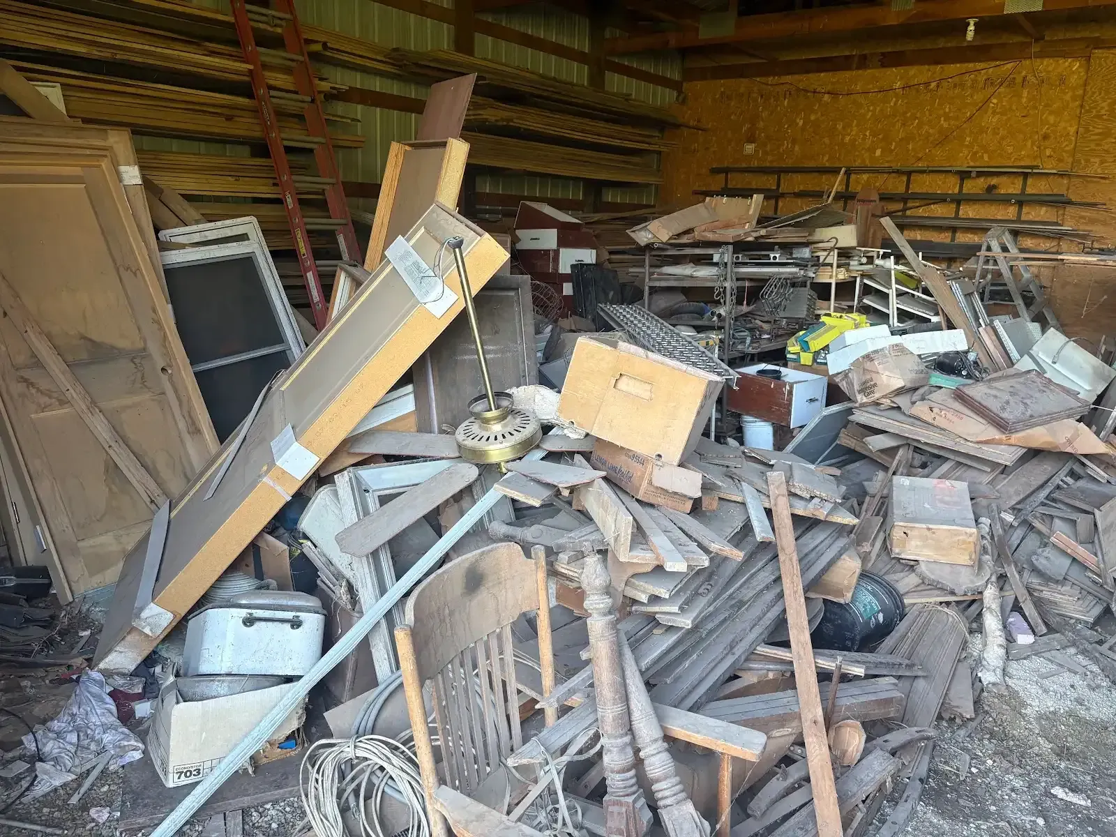 There is a pile of wood in the middle of a room.