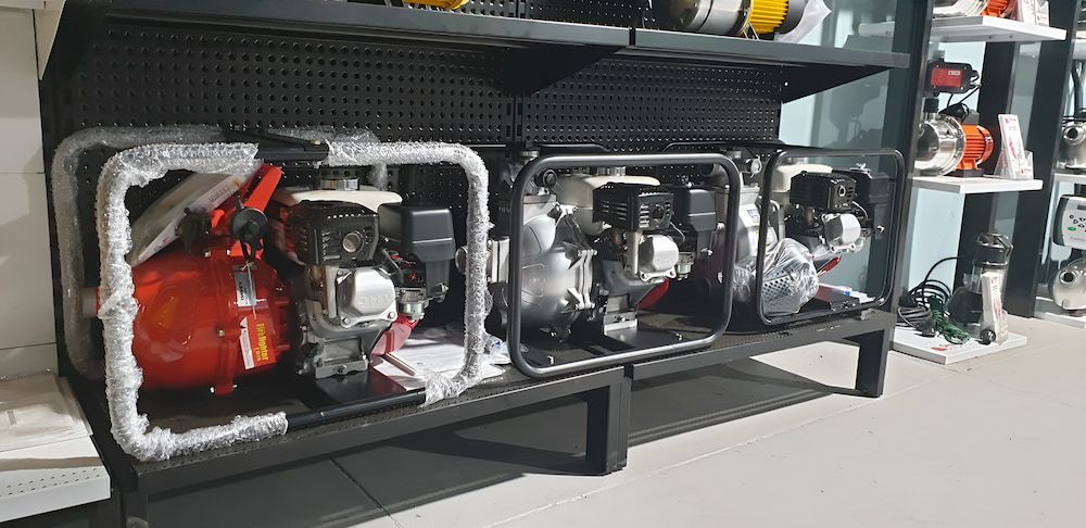 A Shelf Filled With A Variety Of Pump In A Store — Manning Valley Pumps And Irrigation In Wingham, NSW