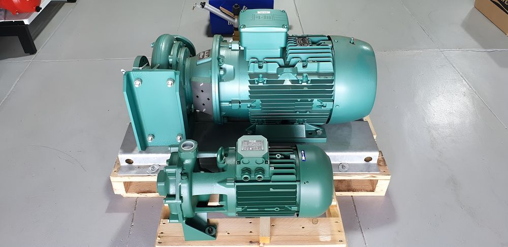 Two Green Pump Are Sitting On A Wooden Pallet — Manning Valley Pumps And Irrigation In Wingham, NSW