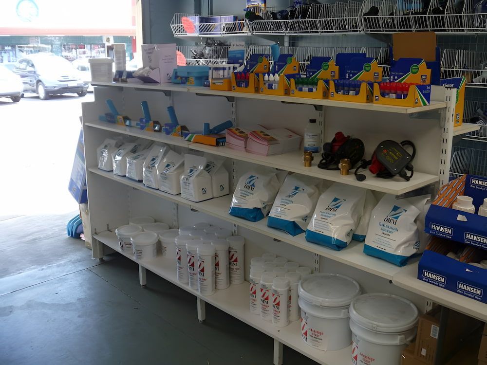 A Store Shelf Filled With A Variety Of Pool Products — Manning Valley Pumps And Irrigation In Taree, NSW