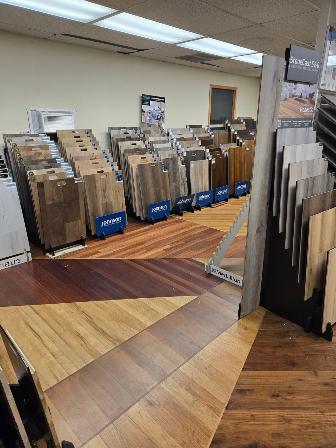 A Stack Of Wooden Planks Sitting On Top Of A Wooden Floor - Auburn And Redding, CA - Auburn Hardwoods