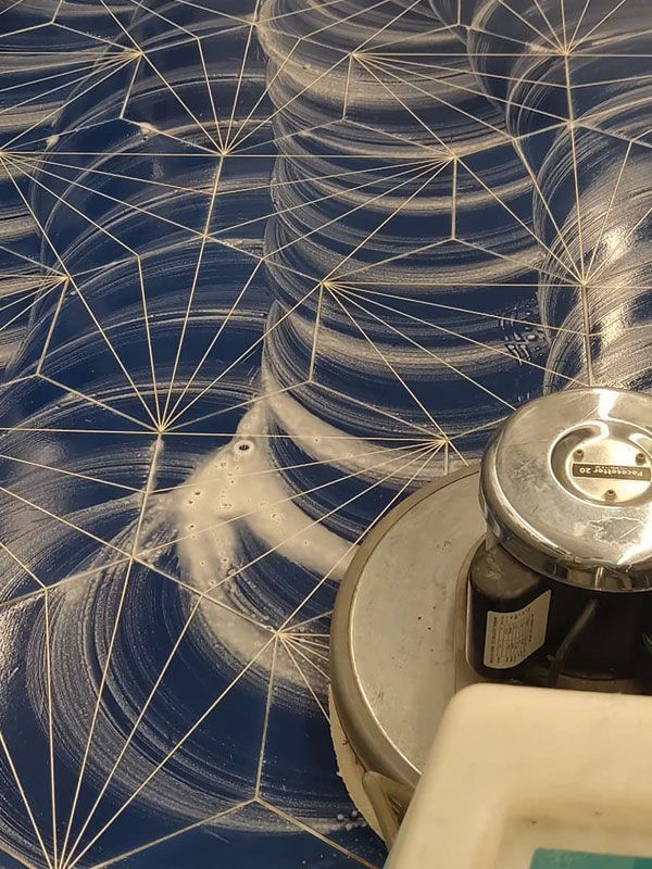 A close up of a faucet with a blue background