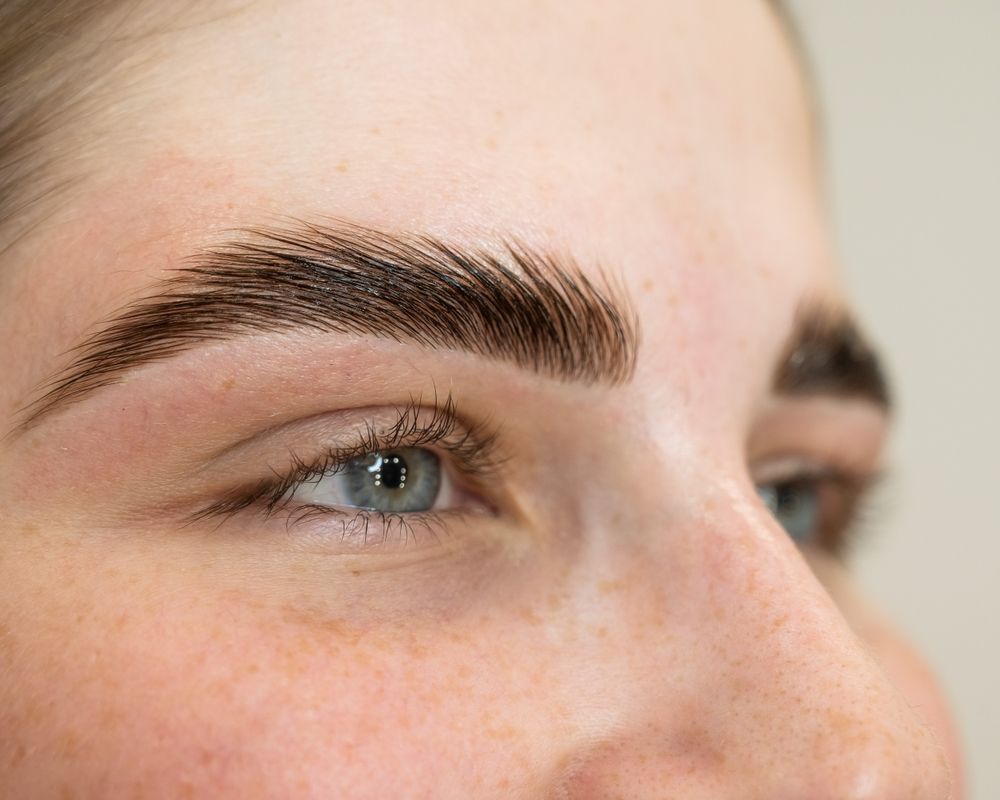 A Close Up of a Woman 's Face With Her Hands on It — Aria Skin & Beauty in Gympie, QLD