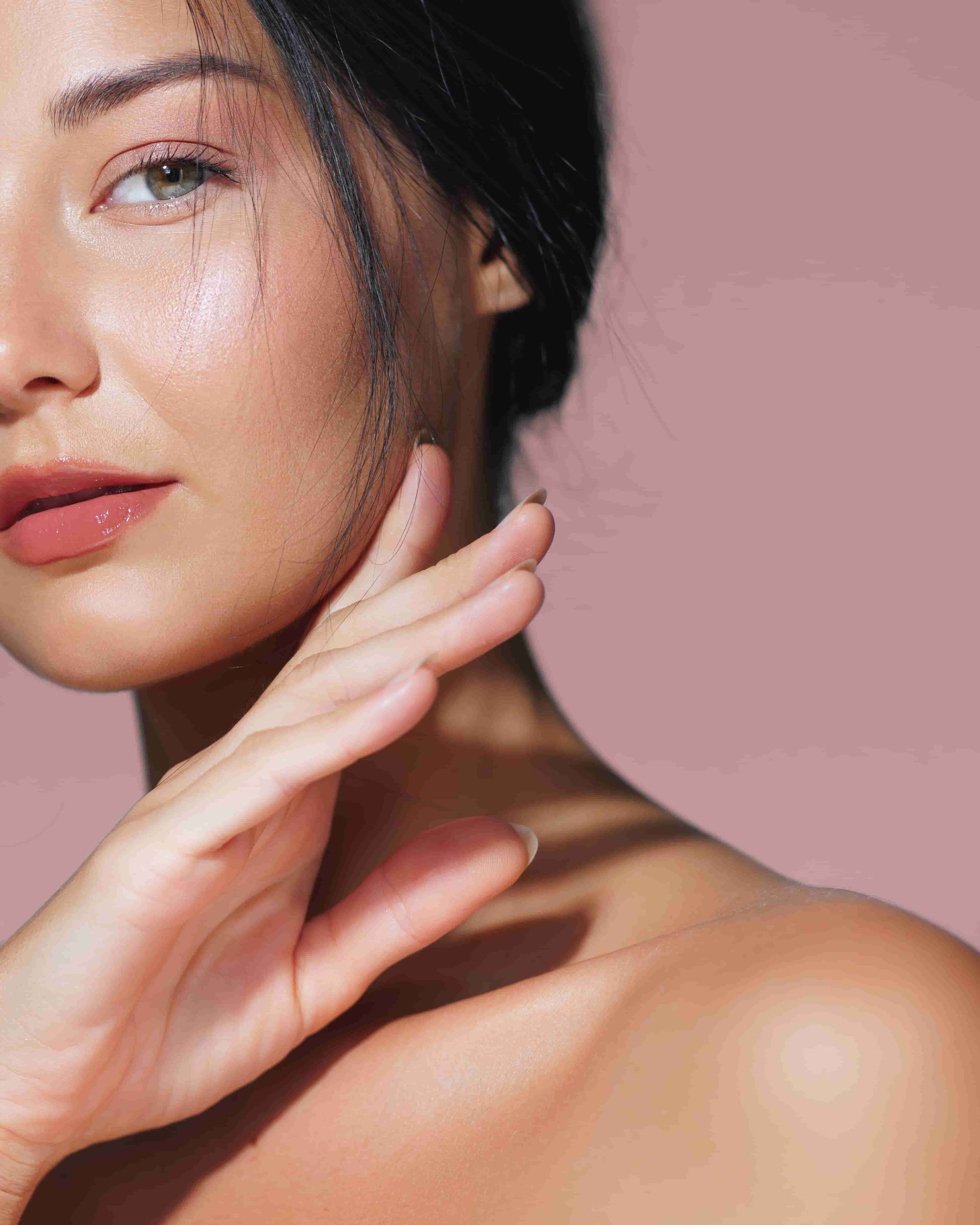 A Close Up of a Woman 's Face With Her Hand on Her Chin — Aria Skin & Beauty in Gympie, QLD