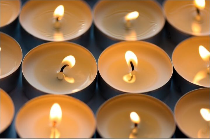 Group of lit candles in soft light, funeral homes in Kennesaw, GA