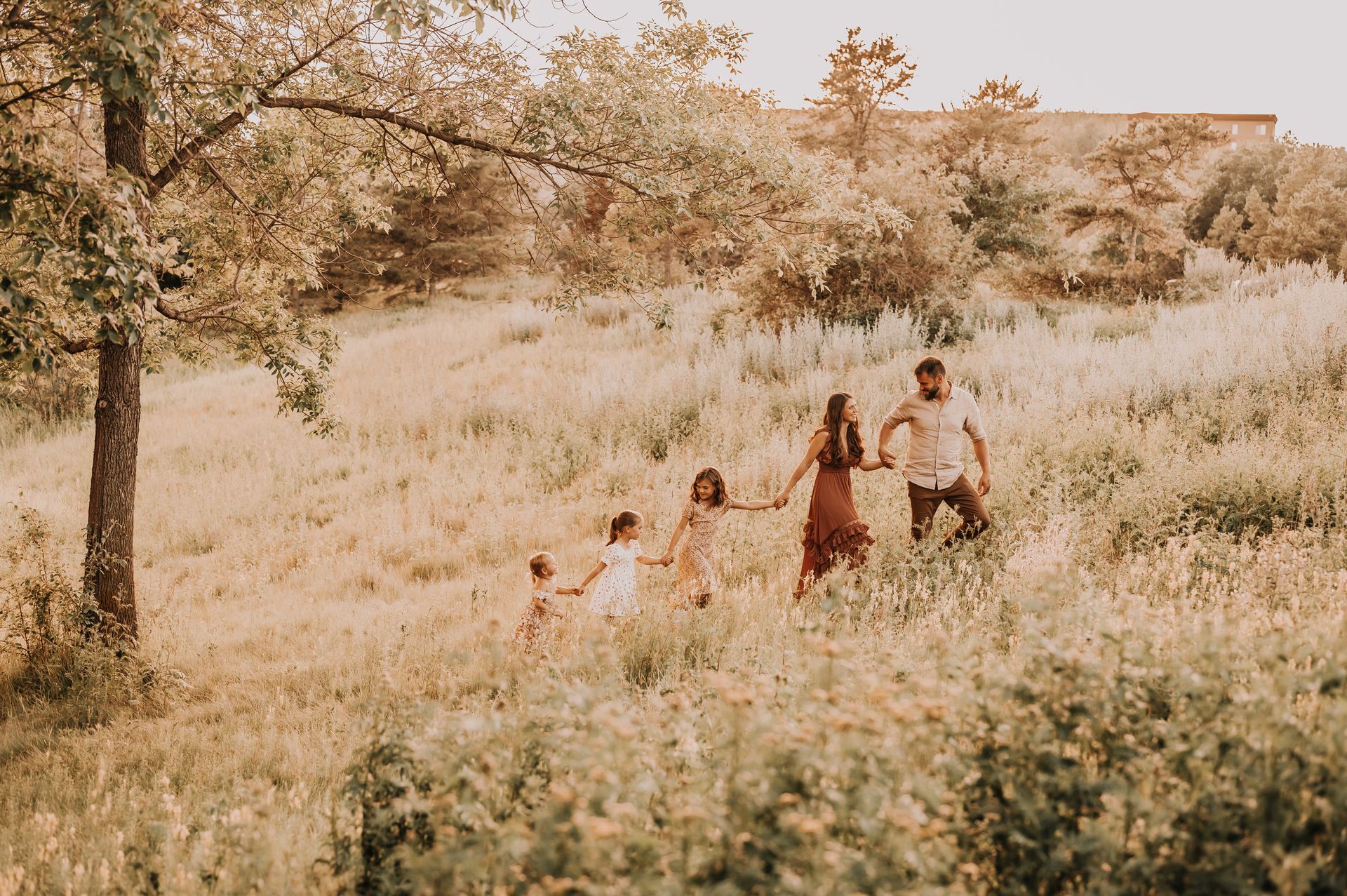 A Family walking up a hill for family photography