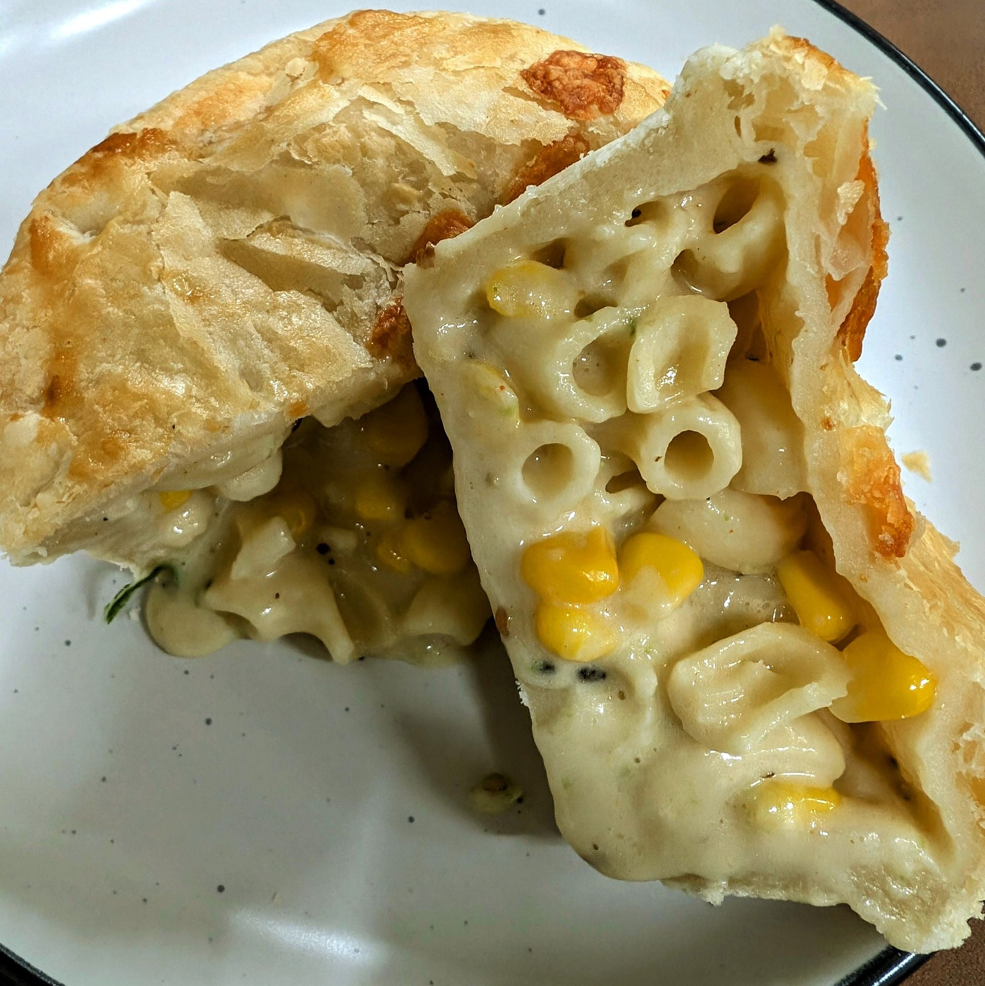 A cross section of a Mac & Cheese pie