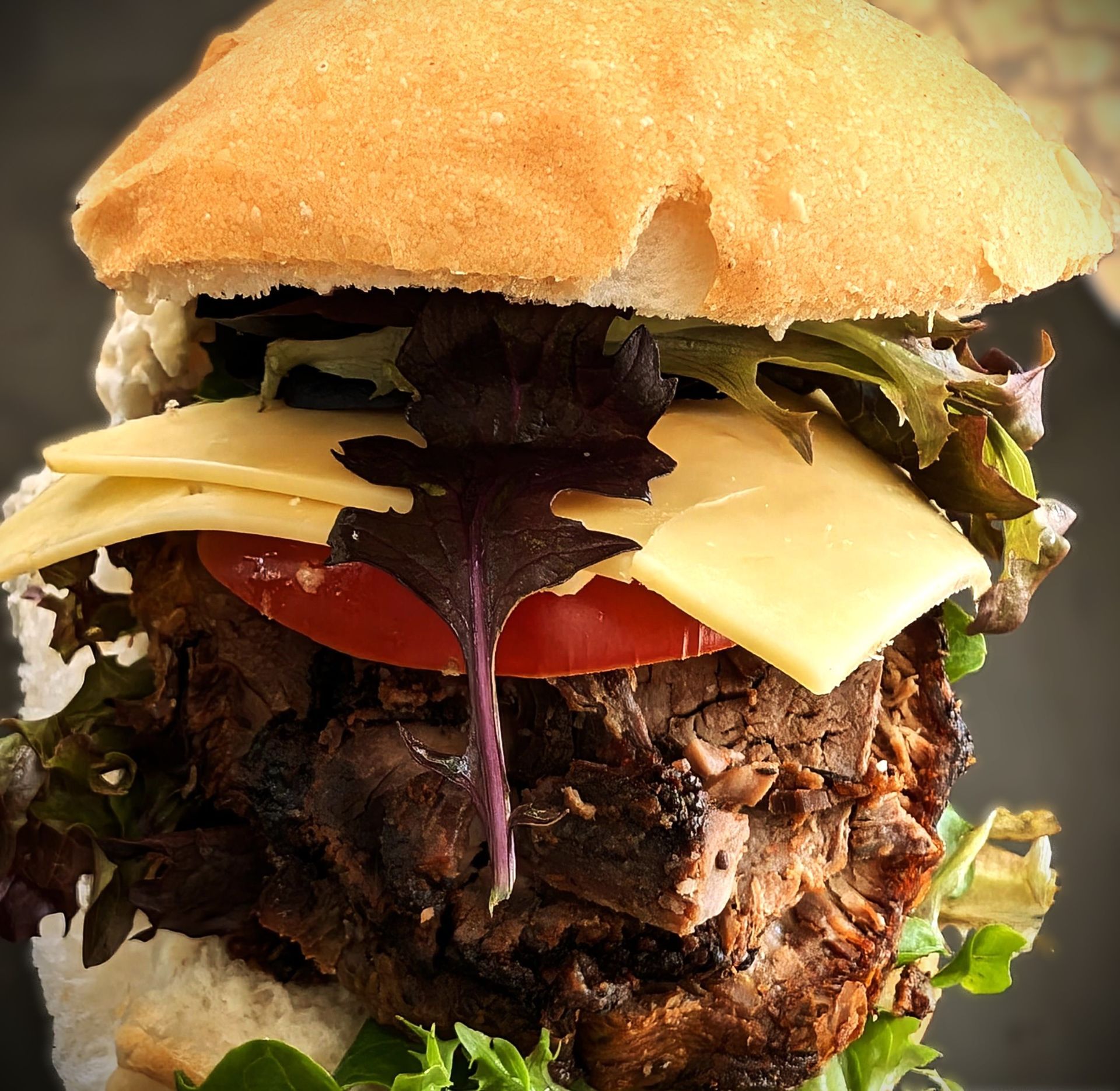 A close up of a stacked roll of fresh salad