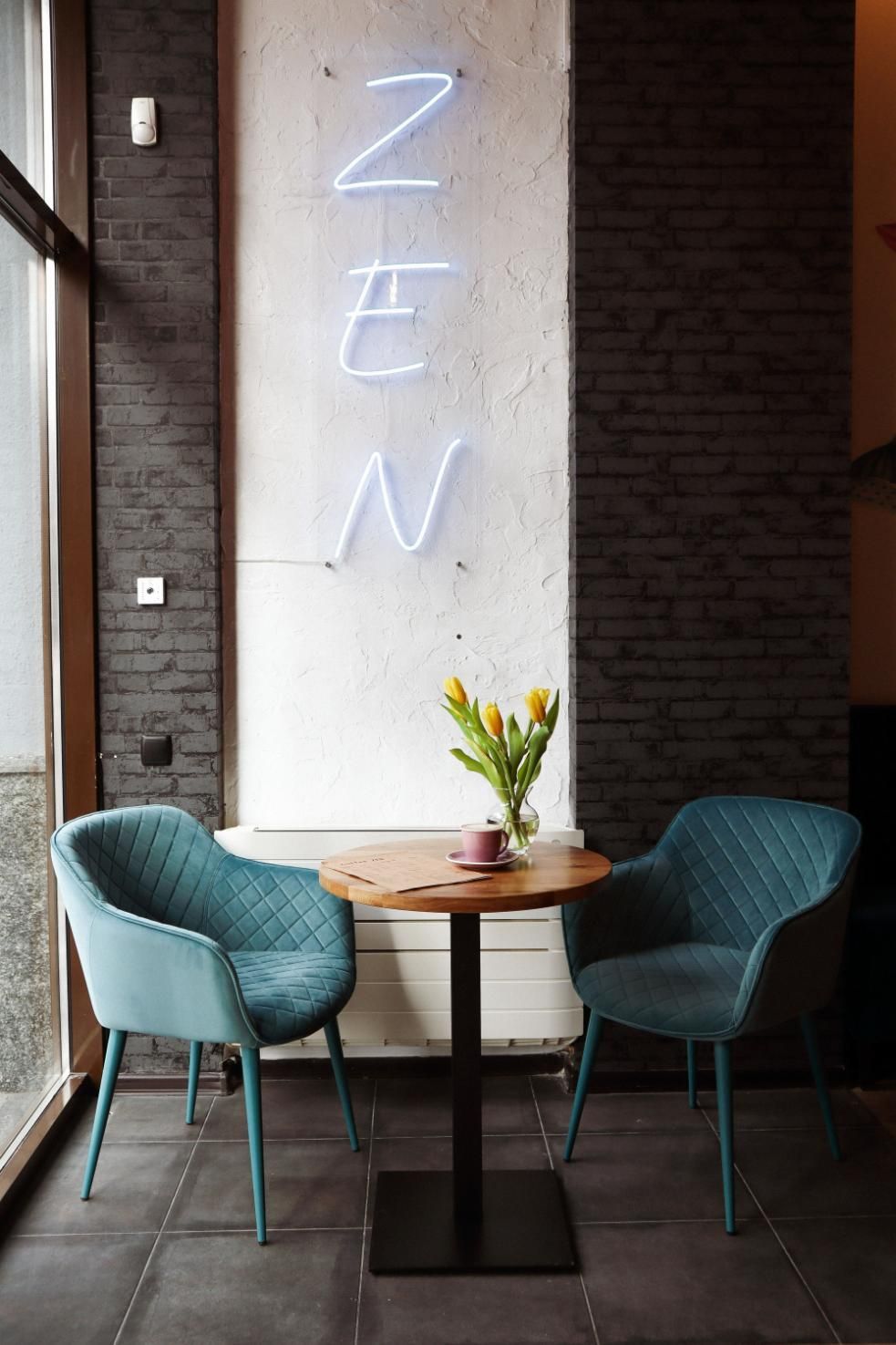 There Is a Neon Sign on The Wall Above the Table and Chairs — Creative Commercial Furniture in Sydney, QLD