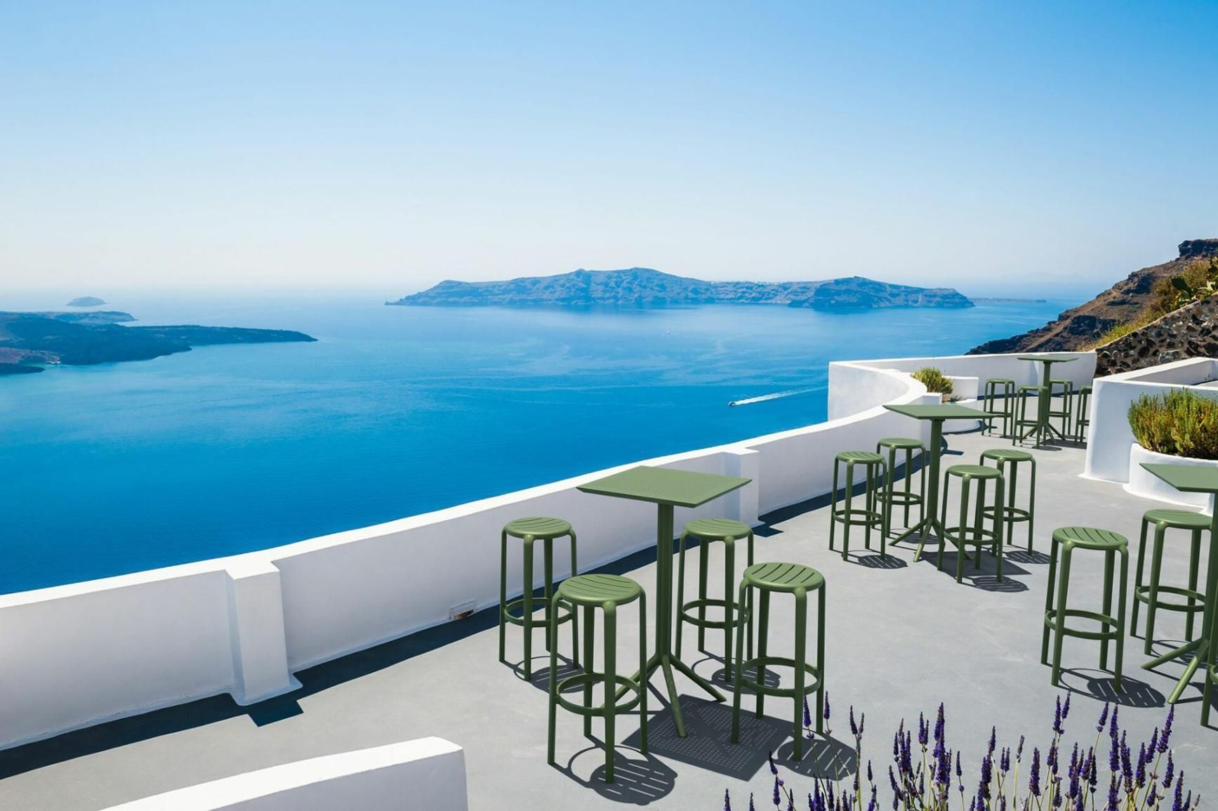 A Patio with Tables and Stools Overlooking the Ocean — Creative Commercial Furniture in Cairns City, QLD