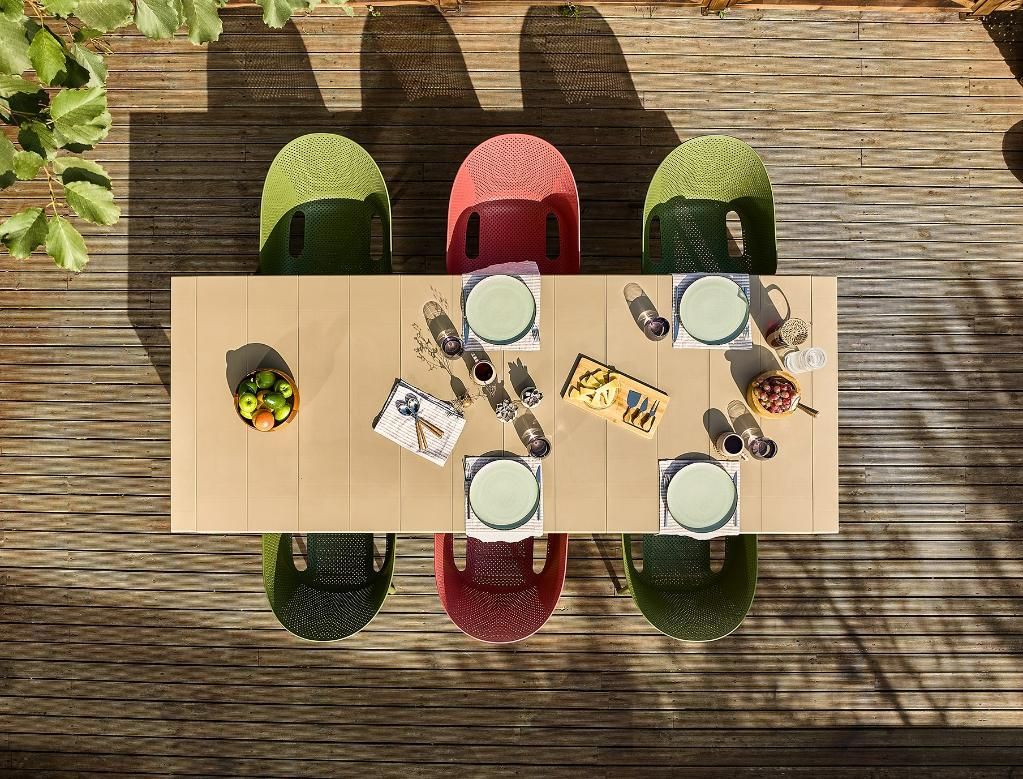 An Aerial Top View of A Table and Chairs on A Wooden Deck — Creative Commercial Furniture in Cairns City, QLD