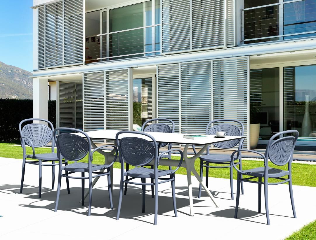 A White Table With Eight Gray Rope-backed Chairs on a Sunny Patio — Creative Commercial Furniture in Gold Coast, QLD