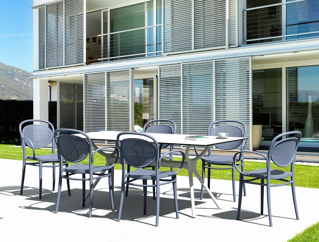 A Patio with A Table and Chairs in Front of A House — Creative Commercial Furniture in Cairns City, QLD