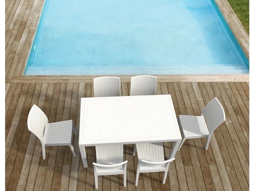 A Table and Chairs on a Wooden Deck Next to a Swimming Pool β Creative Commercial Furniture in Cairns City, QLD