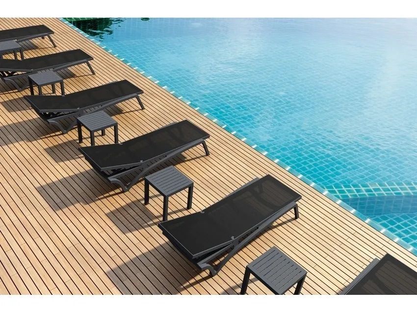 A Row of Lounge Chairs and Tables Next to a Swimming Pool β Creative Commercial Furniture in Cairns City, QLD