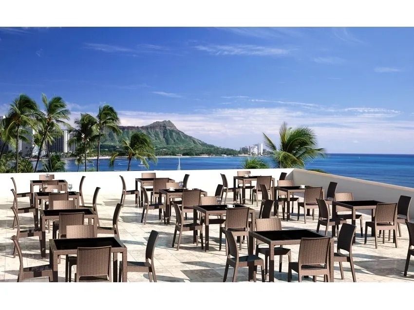 A Restaurant With Tables and Chairs Overlooking the Ocean — Creative Commercial Furniture in Cairns City, QLD 