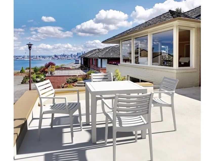 A Patio With a Table and Chairs in Front of a House β Creative Commercial Furniture in Cairns City, QLD