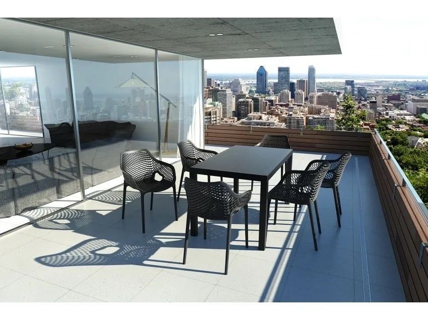 A Balcony With a Table and Chairs Overlooking a City β Creative Commercial Furniture in Cairns City, QLD