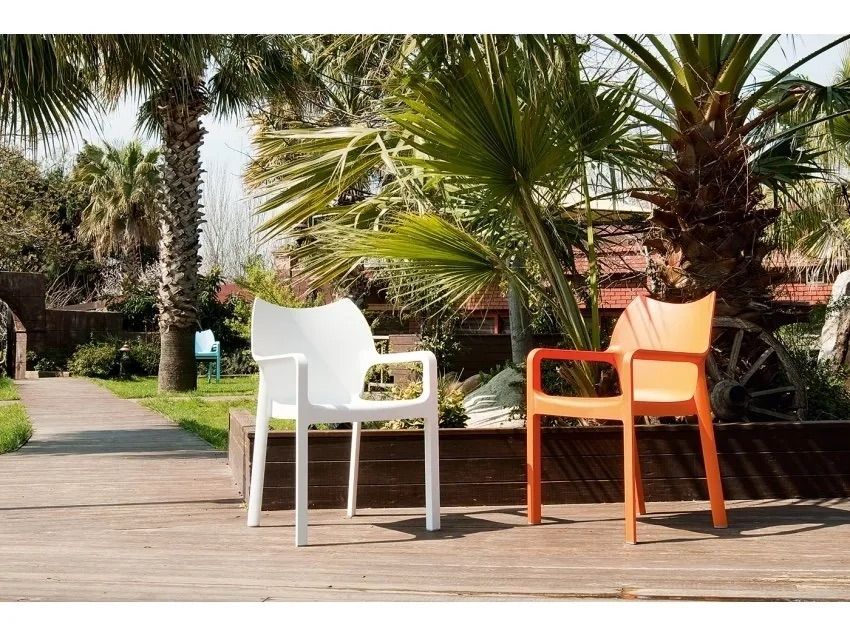 Two Chairs Are Sitting on a Wooden Deck in Front of Palm Trees β Creative Commercial Furniture in Cairns City, QLD