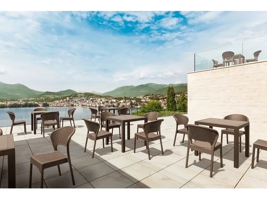 A Patio With Tables and Chairs With a View of the Ocean β Creative Commercial Furniture in Cairns City, QLD