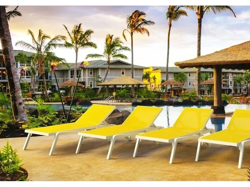 A Row of Yellow Lounge Chairs Next to a Pool β Creative Commercial Furniture in Cairns City, QLD