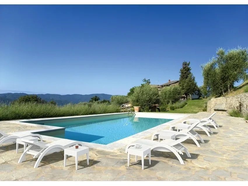 A Swimming Pool With a Lot of Chairs Around It — Creative Commercial Furniture in Cairns City, QLD 