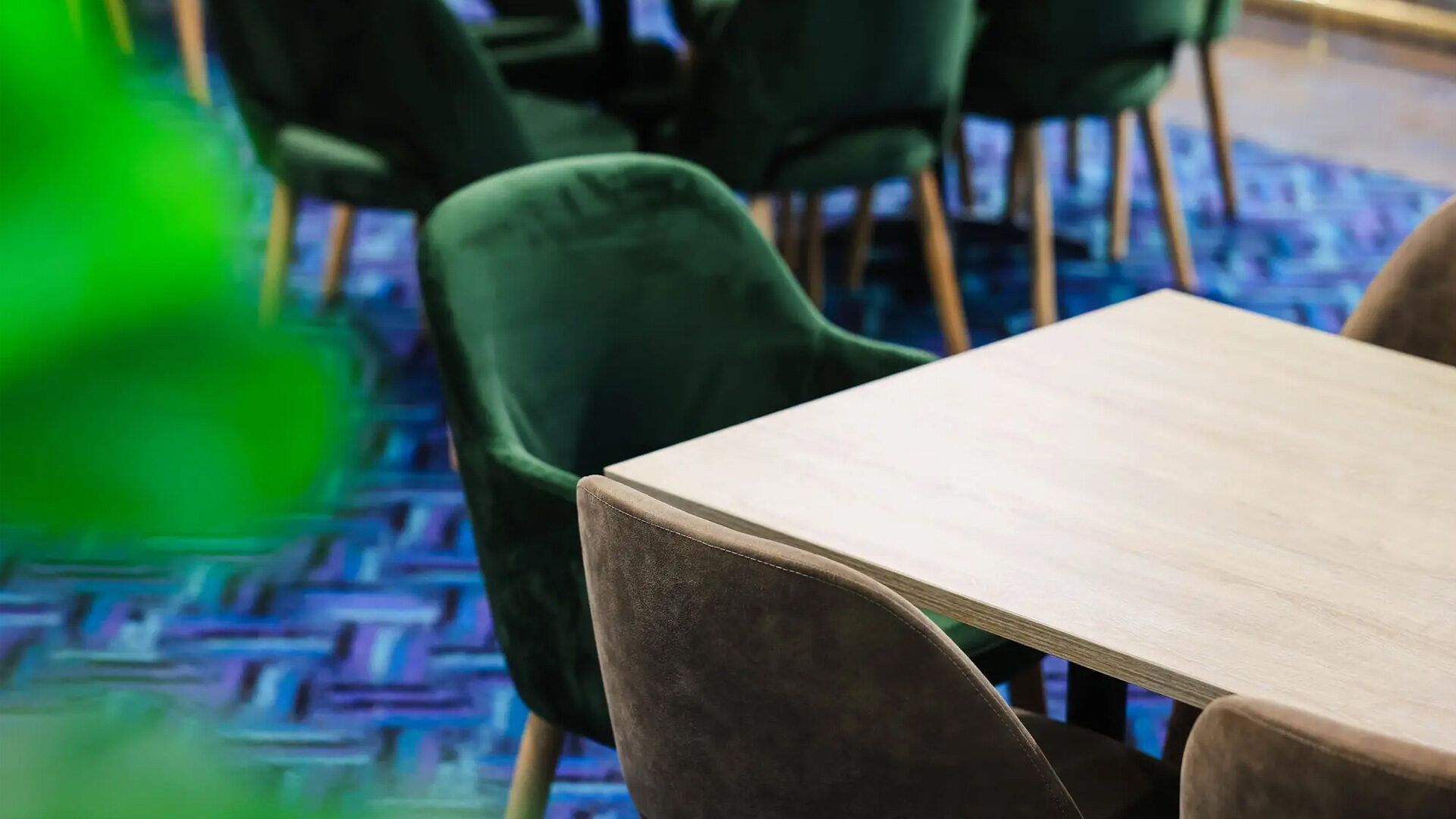 A Restaurant Table and Green Velvet Chairs — Creative Commercial Furniture in Cairns City, QLD
