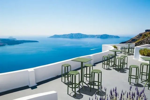 Patio With Tables and Stools Overlooking the Ocean — Creative Commercial Furniture in Cairns City, QLD