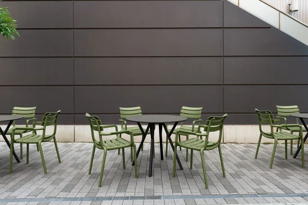 A Row of Green Chairs and Tables in Front of a Building β Creative Commercial Furniture in Cairns City, QLD