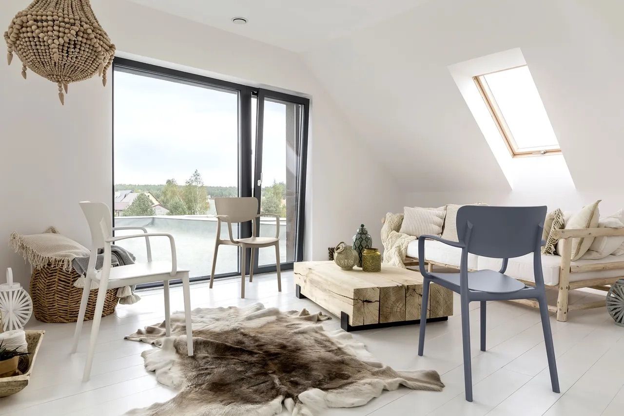 Bright Living Room With White Walls, Large Window, Wooden Furniture — Creative Commercial Furniture in Cairns City, QLD