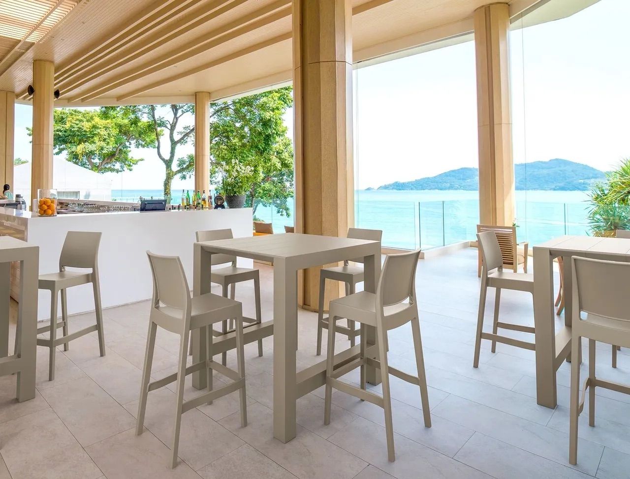 A Restaurant With Tables and Chairs and a View of the Ocean β Creative Commercial Furniture in Cairns City, QLD