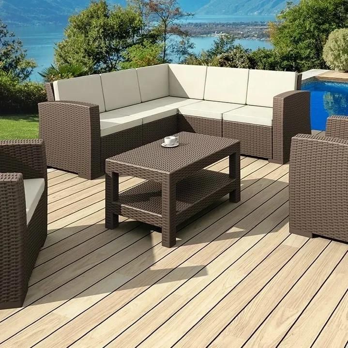 A Wooden Deck with Wicker Furniture and A Coffee Table — Creative Commercial Furniture in Cairns City, QLD