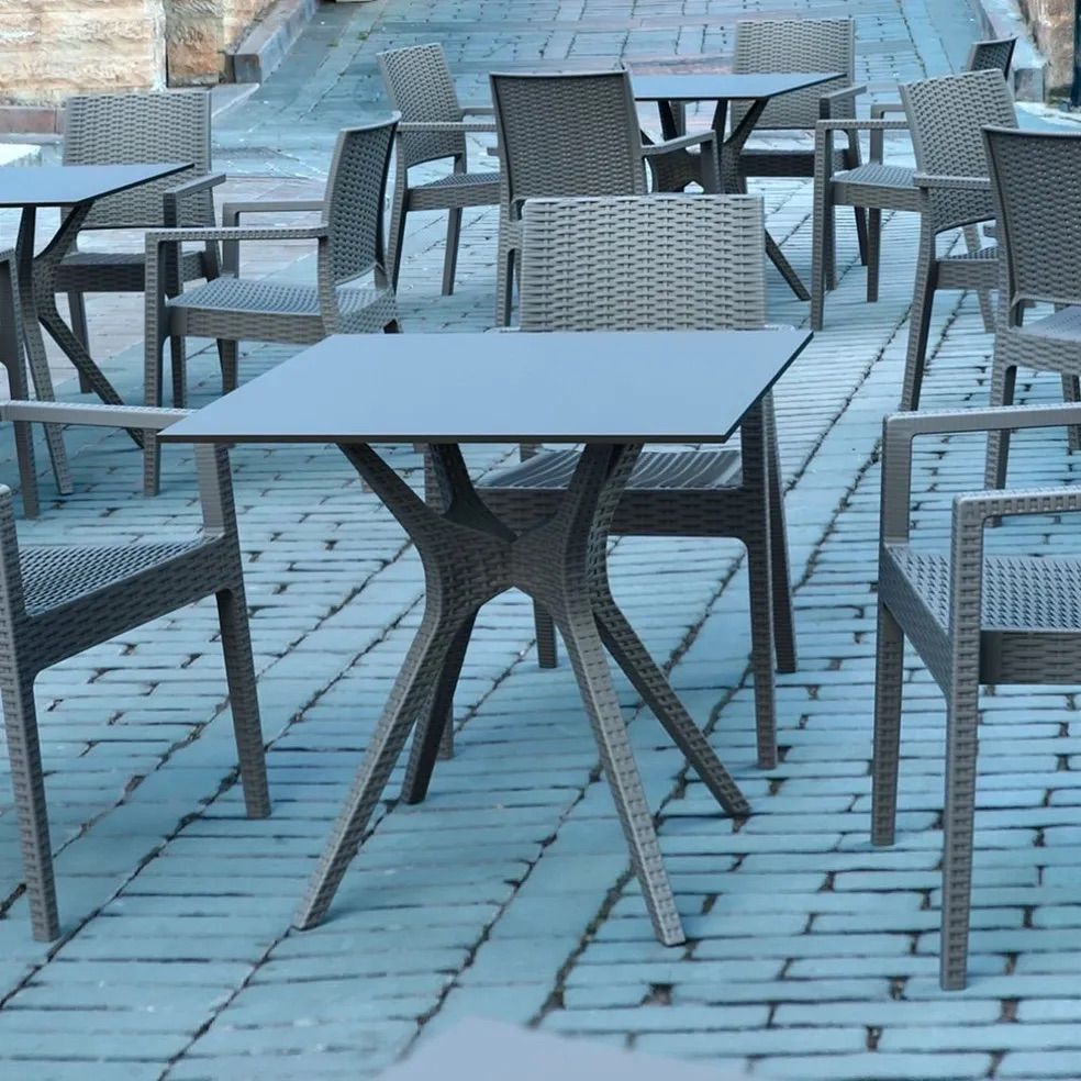A Row of Tables and Chairs on a Brick Sidewalk β Creative Commercial Furniture in Cairns City, QLD