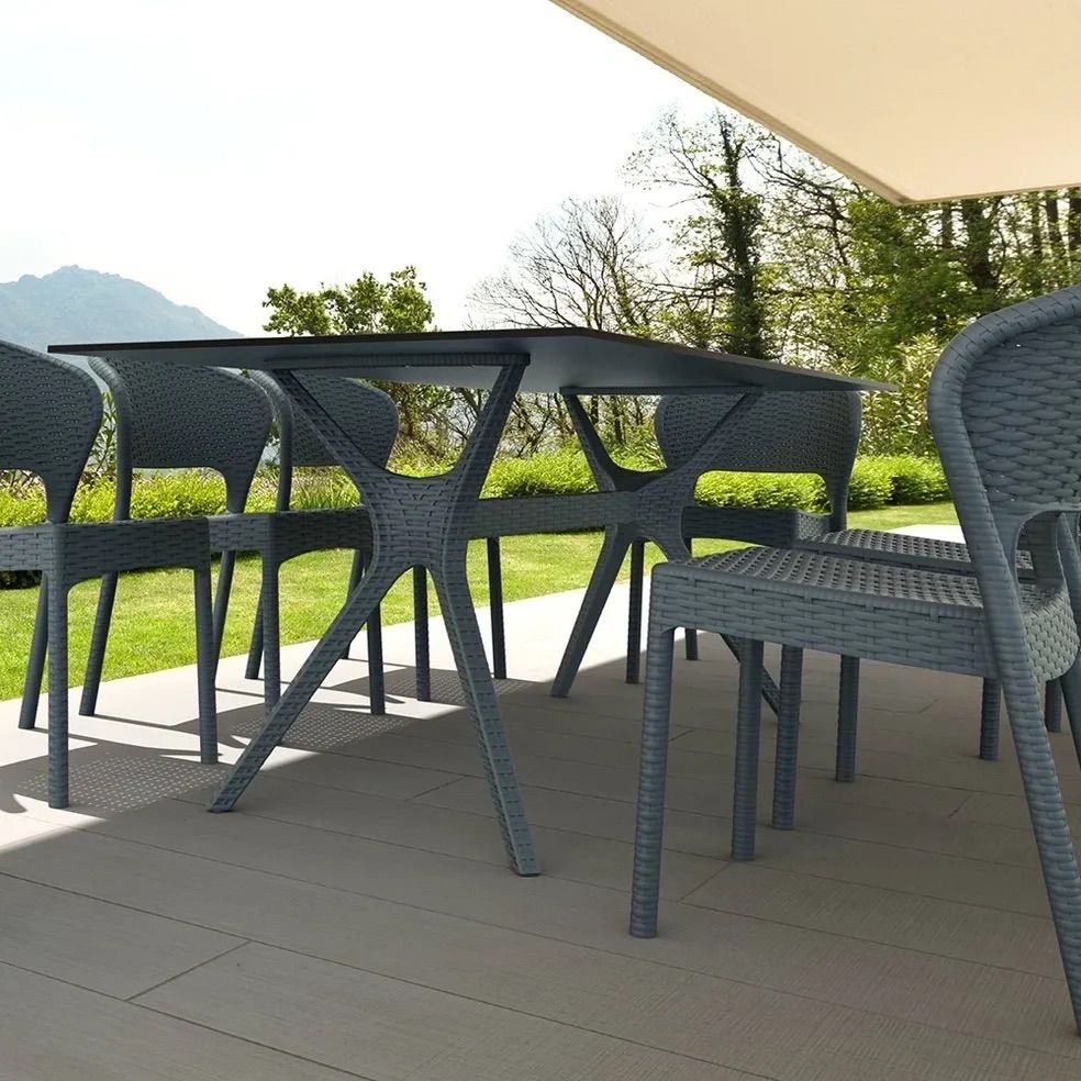 Outdoor Dining Set With a Dark Gray Table and Chairs on a Patio — Creative Commercial Furniture in Cairns City, QLD