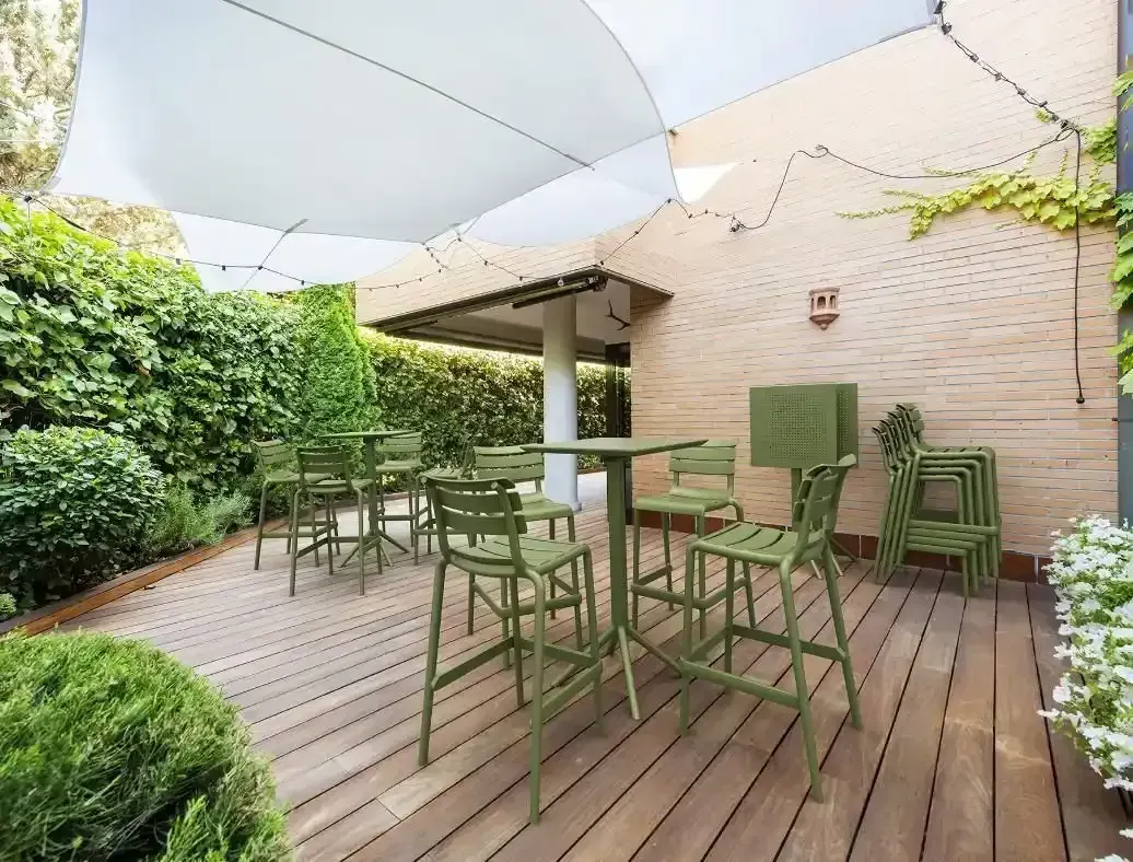 Outdoor Patio With Green Chairs and Table — Creative Commercial Furniture in Sunshine Coast, QLD