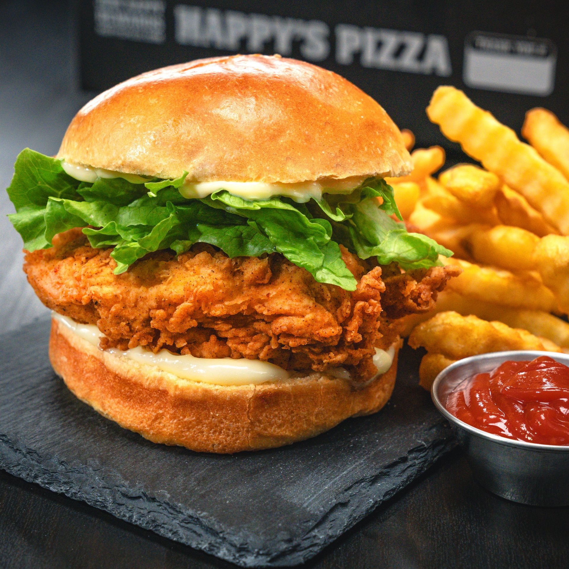 Happy's Chicken Sandwich: A juicy fried chicken breast topped with cool mayo, pickles and lettuce.