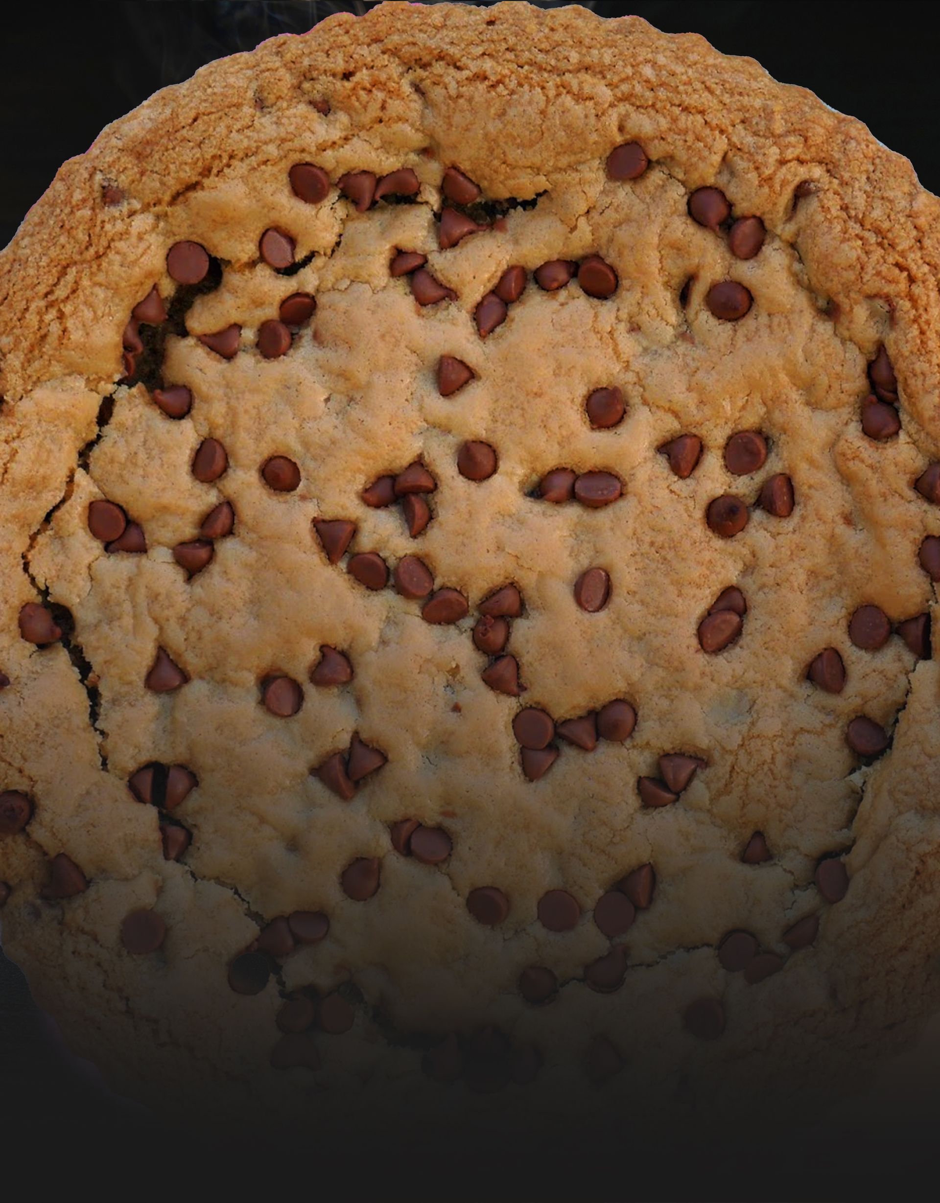A close up of a chocolate chip cookie on a black background