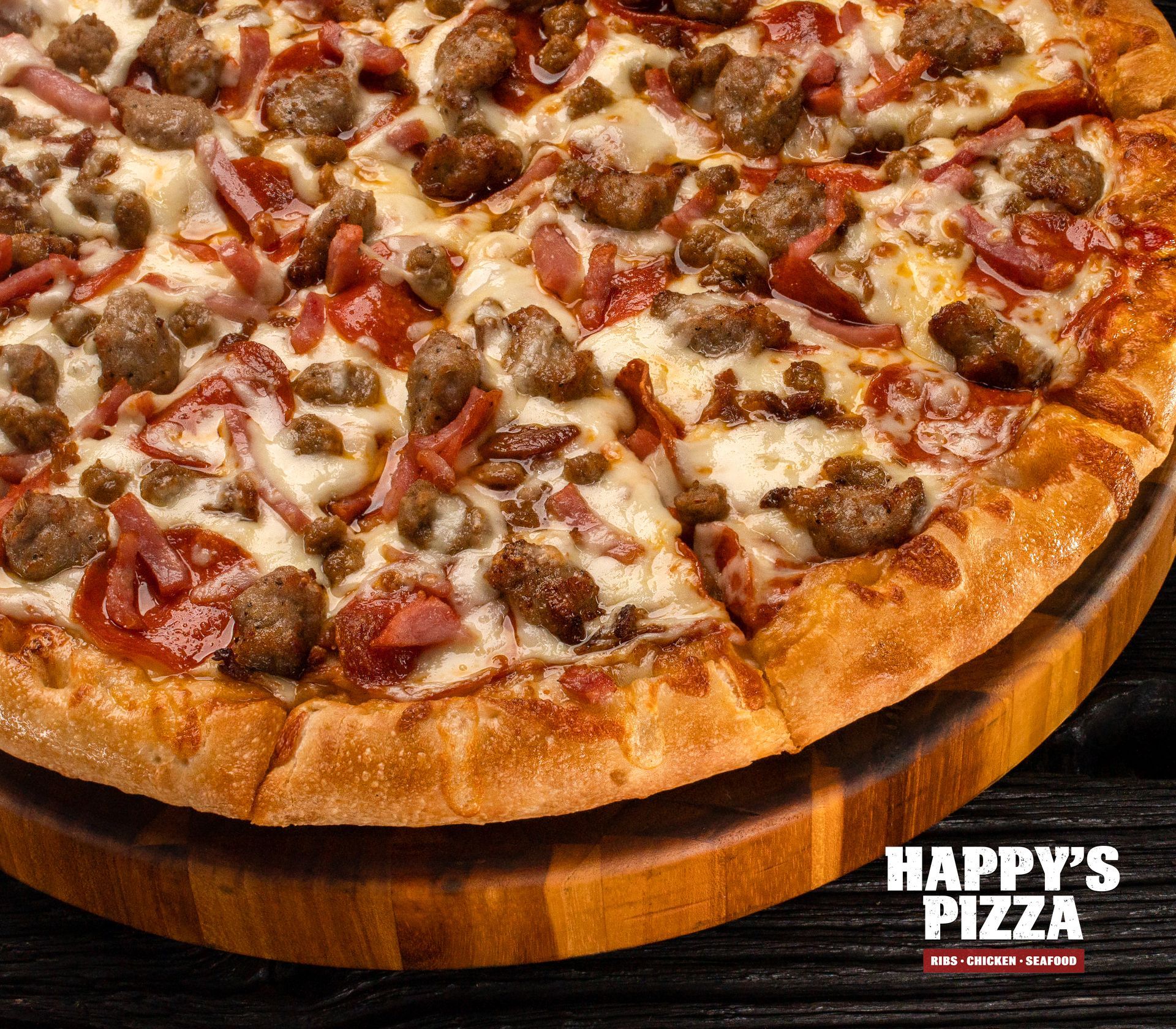 A pizza from happy 's pizza is on a wooden cutting board
