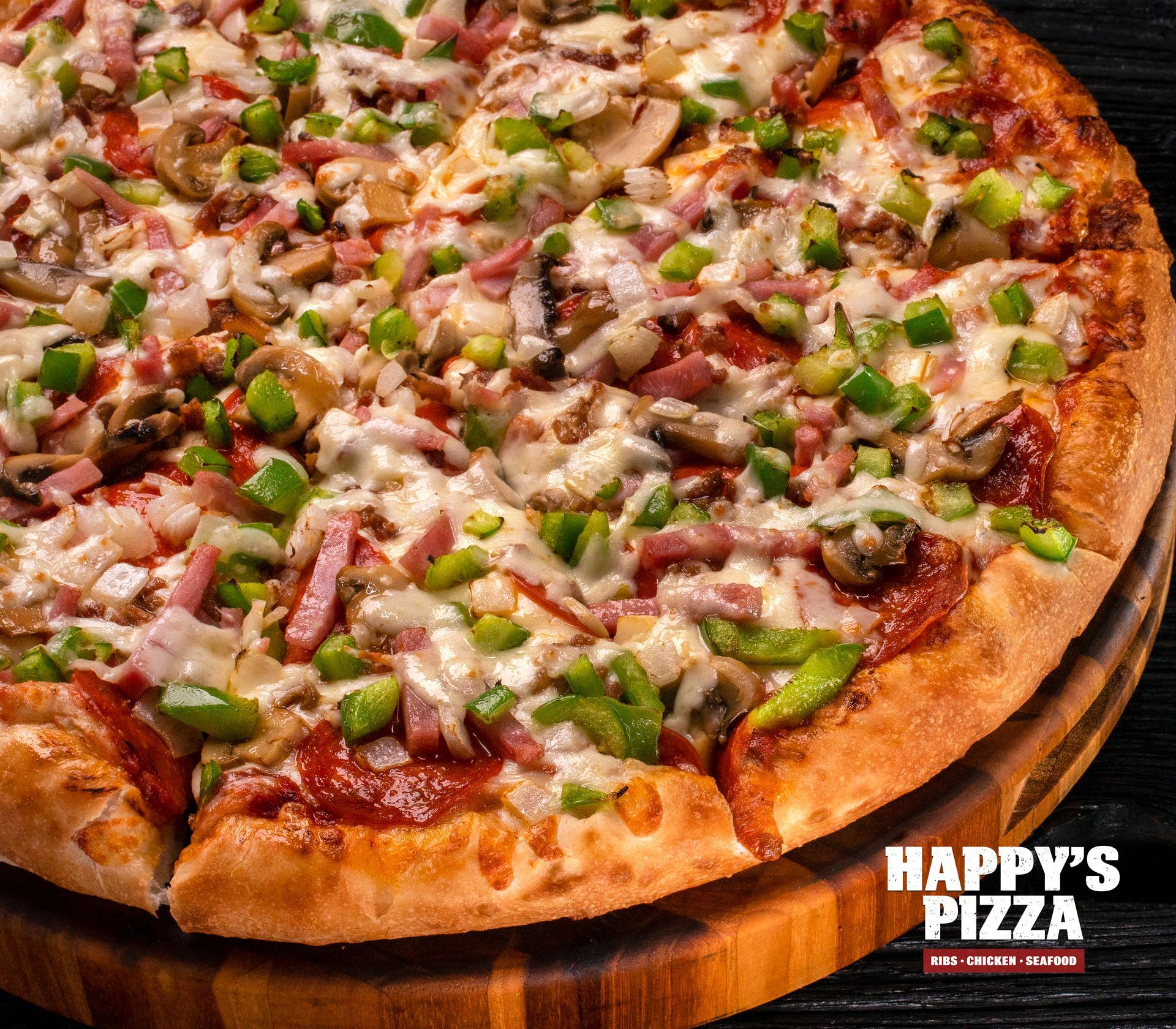 A pizza from happy 's pizza is sitting on a wooden cutting board.