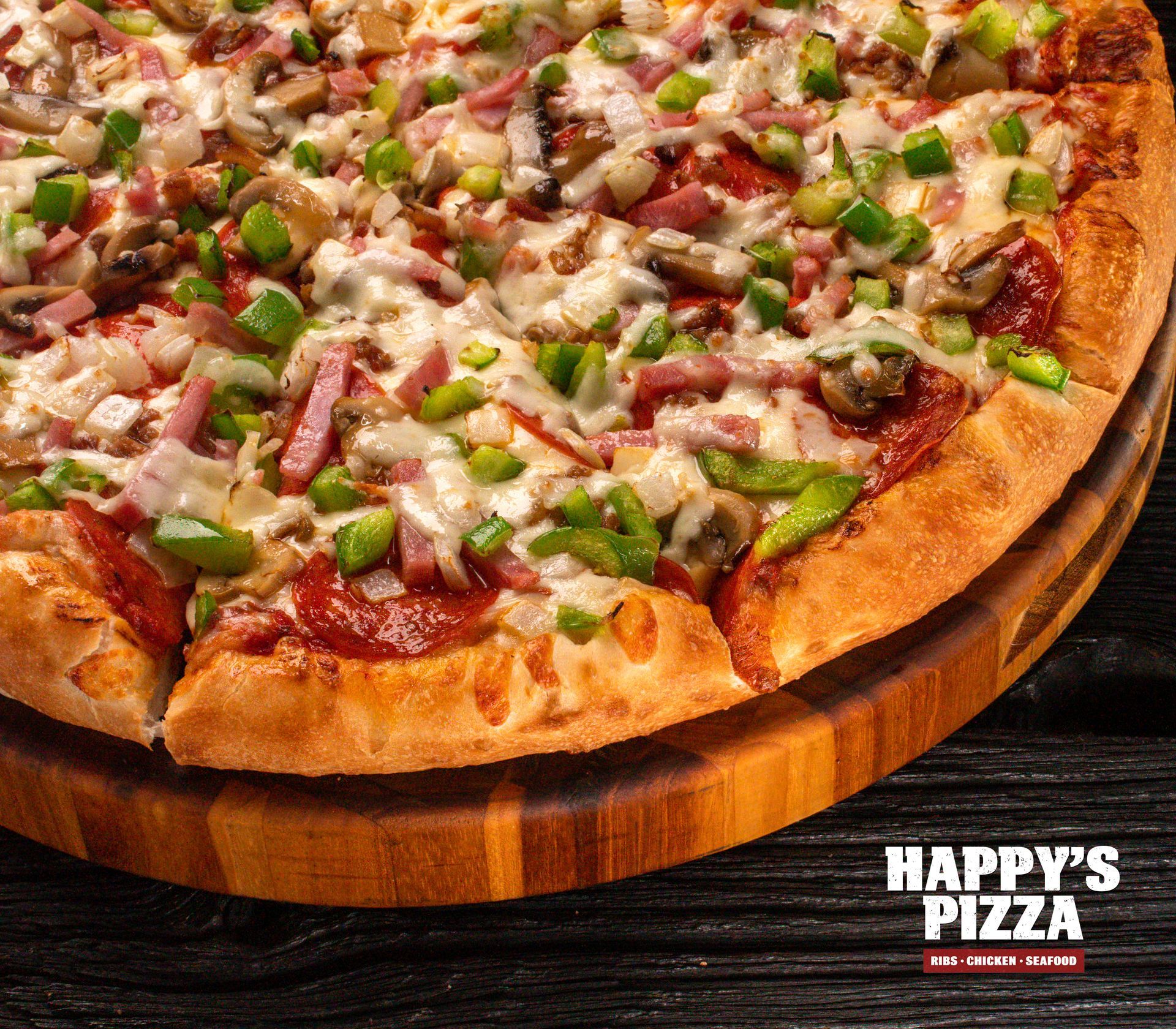A pizza from happy 's pizza is on a wooden cutting board