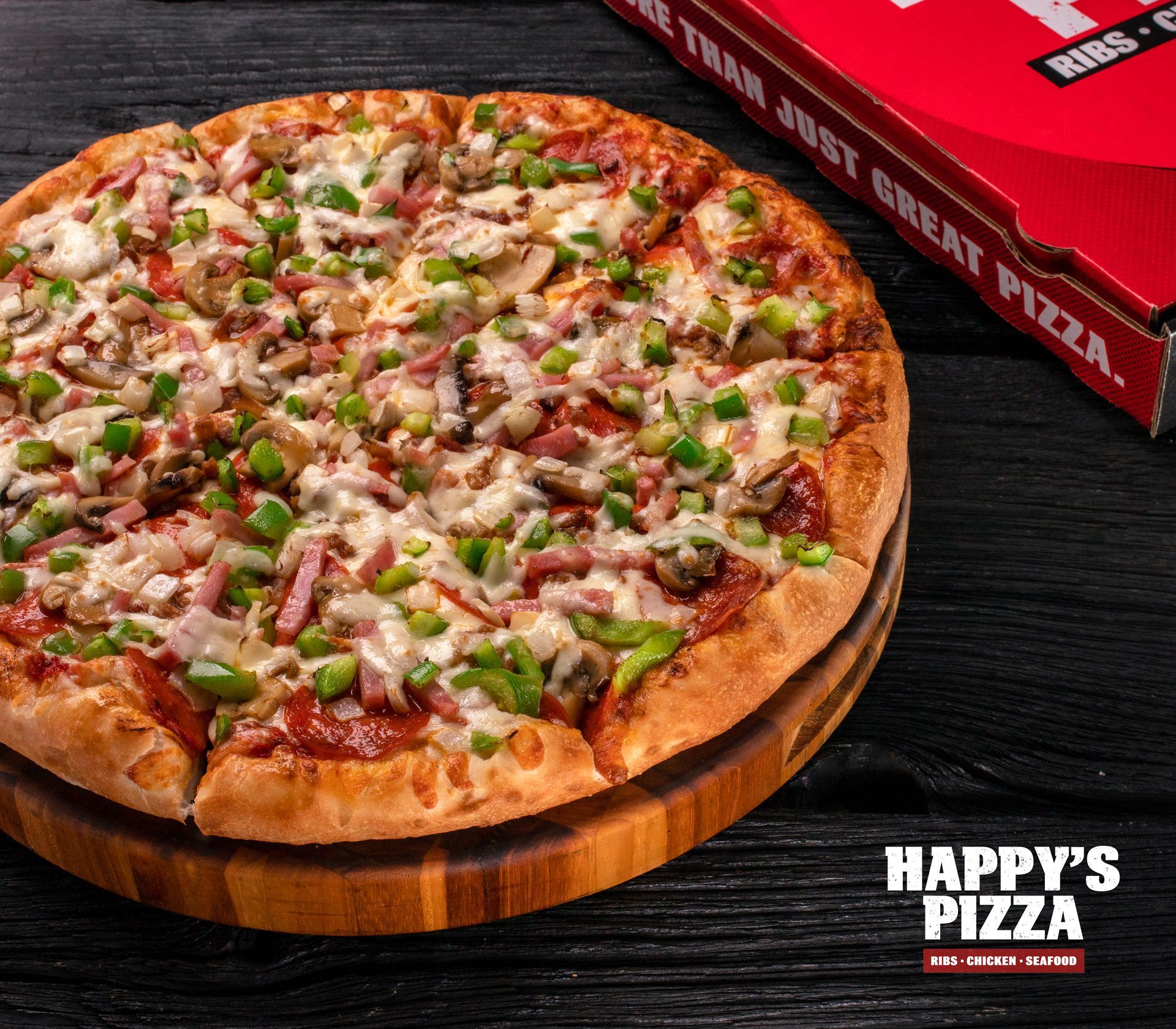 A pizza from happy 's pizza is on a wooden cutting board